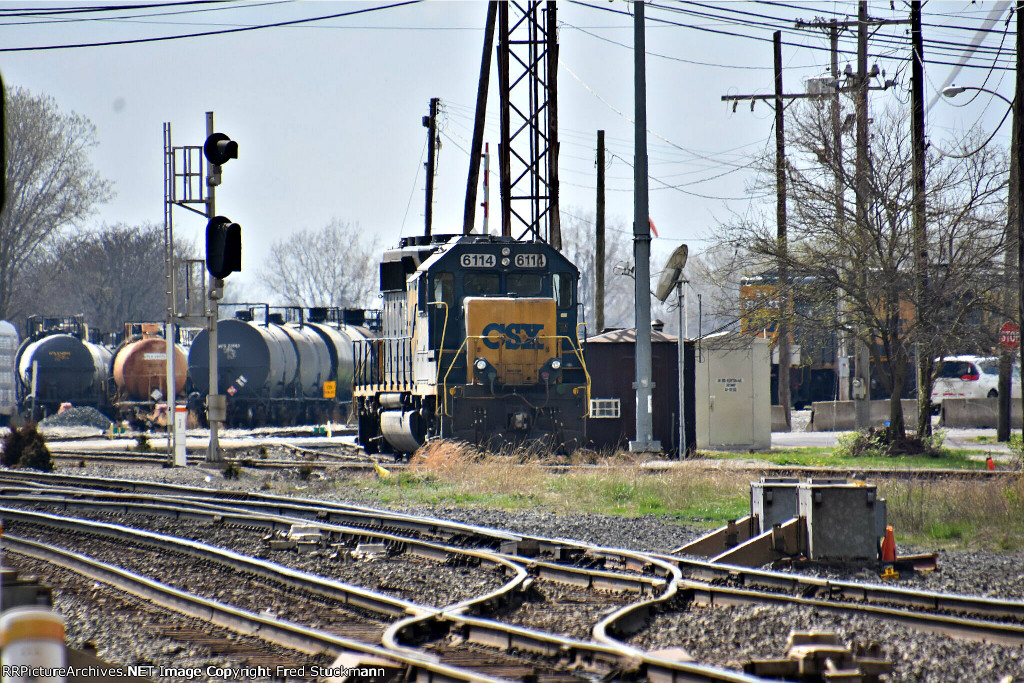 CSX 6114 with another one hiding around the corner.